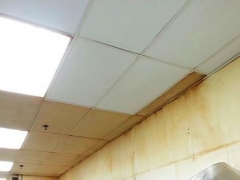 Ceiling tiles being cleaned